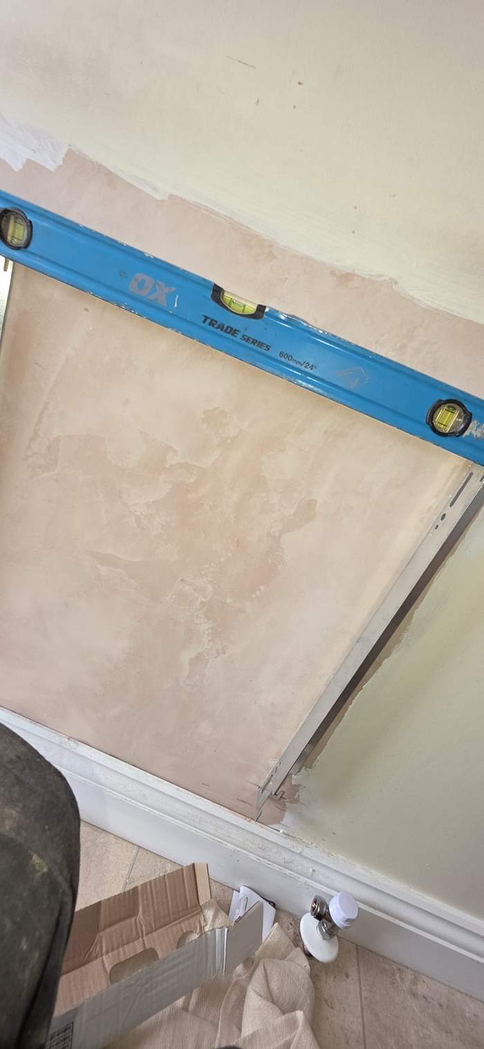 Wall re-plastered and levelled ready for a new radiator bracket
