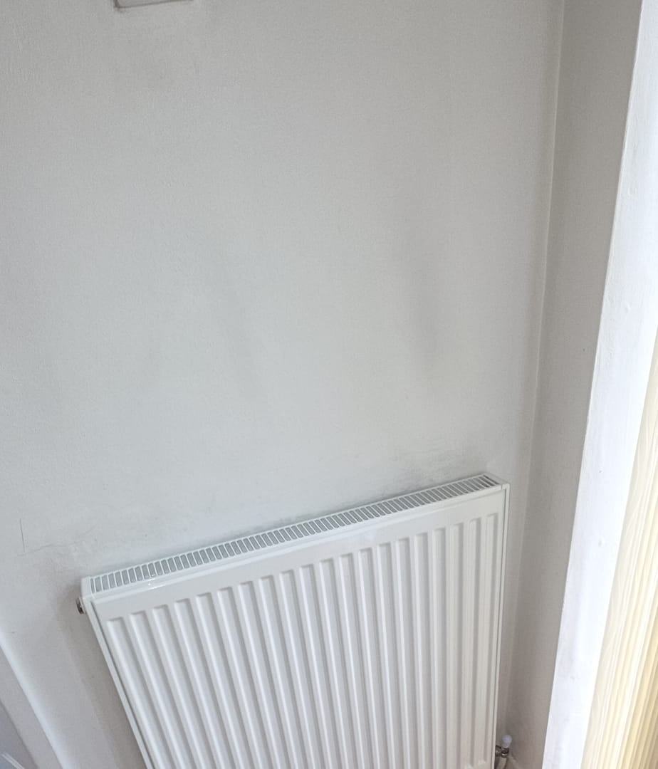 Radiator neatly installed in a corner